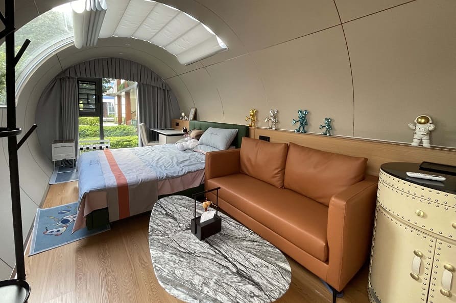 The interior of the capsule is customized with  one living room